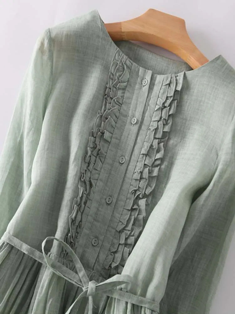 Arya™ | Damesjurk in retrostijl met ronde hals en strikceintuur